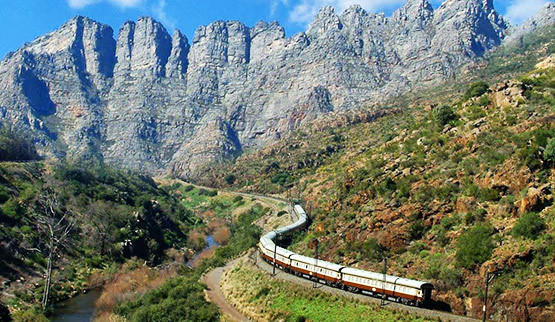 A train meandering through the mountain side.